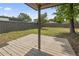 A partially covered backyard deck provides a tranquil outdoor space with a view of the lawn and perimeter fence at 931 Cedarwood Circle, Myrtle Beach, SC 29572