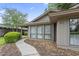 Home with large windows and a tidy landscape at 931 Cedarwood Circle, Myrtle Beach, SC 29572