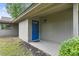 Charming front door with blue paint, a covered porch, and well-maintained landscaping at 931 Cedarwood Circle, Myrtle Beach, SC 29572