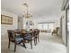 Open-concept dining and living area with fireplace and view to the outside at 931 Cedarwood Circle, Myrtle Beach, SC 29572