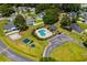 Aerial showing the community pool, playground, and well-manicured landscaping at 9607 Kings Grant Dr., Murrells Inlet, SC 29576
