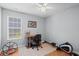 Bright bedroom with a window, ceiling fan, desk and exercise machine at 9607 Kings Grant Dr., Murrells Inlet, SC 29576