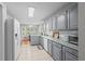 Open kitchen features white appliances, light countertops, and a view to the adjacent dining area at 9607 Kings Grant Dr., Murrells Inlet, SC 29576