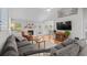 Bright living room featuring a vaulted ceiling, fireplace, and comfortable seating at 9607 Kings Grant Dr., Murrells Inlet, SC 29576