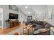 Spacious living room with hardwood floors, vaulted ceilings, and comfortable sectional sofa at 9607 Kings Grant Dr., Murrells Inlet, SC 29576