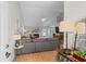 Bright living room featuring a vaulted ceiling, fireplace, and cozy decor at 9607 Kings Grant Dr., Murrells Inlet, SC 29576