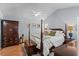 This main bedroom features a vaulted ceiling, a ceiling fan, and a four-poster bed at 9607 Kings Grant Dr., Murrells Inlet, SC 29576