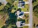 Aerial view of the property showcasing the yard and surrounding neighborhood at 100 Woodlyn Ave., Little River, SC 29566