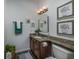 Cozy bathroom with granite counters, decorative accents, and elegant lighting fixtures at 100 Woodlyn Ave., Little River, SC 29566