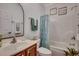 Well-lit bathroom with a combination shower and tub, accented with fresh towels and decor at 100 Woodlyn Ave., Little River, SC 29566