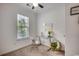 Bright bedroom with a sunny window, desk, and decorative accents for a cozy and productive space at 100 Woodlyn Ave., Little River, SC 29566