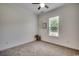 Serene bedroom featuring neutral walls and carpet, complemented by natural light from a window at 100 Woodlyn Ave., Little River, SC 29566
