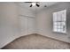 Neutral bedroom featuring a double closet and window that offers ample sunlight at 100 Woodlyn Ave., Little River, SC 29566