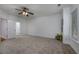 Spacious bedroom featuring a ceiling fan, neutral carpeting, and ample natural light from the window at 100 Woodlyn Ave., Little River, SC 29566