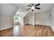 Bright bedroom with wood floors, high ceiling, and ample space at 100 Woodlyn Ave., Little River, SC 29566