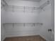 Walk-in closet featuring carpet and wire shelving for clothing and accessories storage at 100 Woodlyn Ave., Little River, SC 29566