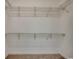 Spacious walk-in closet with wire shelving, ready for organized storage and personalization at 100 Woodlyn Ave., Little River, SC 29566
