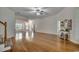 Expansive living room with hardwood floors, staircase access, and elegant decor, perfect for entertaining at 100 Woodlyn Ave., Little River, SC 29566