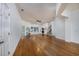 Spacious living room with hardwood floors, abundant natural light, and staircase access at 100 Woodlyn Ave., Little River, SC 29566