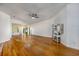Bright living room with hardwood floors, a ceiling fan, and a decorative console table at 100 Woodlyn Ave., Little River, SC 29566