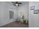 Home office with desk, chair, bright window, and decorative wall art at 100 Woodlyn Ave., Little River, SC 29566