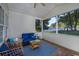 Relaxing screened-in porch with comfortable seating and views of the backyard at 100 Woodlyn Ave., Little River, SC 29566