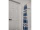 Clean shower with patterned curtain and white door at 100 Woodlyn Ave., Little River, SC 29566