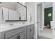 Bathroom featuring double vanity, gray cabinets and framed mirror at 1007 Longwood Bluffs Circle, Murrells Inlet, SC 29576