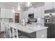 Bright kitchen featuring a large island, stainless steel appliances, white cabinetry, and a walk-in pantry at 1007 Longwood Bluffs Circle, Murrells Inlet, SC 29576
