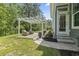 Outdoor patio with pergola, stone pavers, and wicker furniture at 1007 Longwood Bluffs Circle, Murrells Inlet, SC 29576