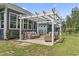 Covered patio with wicker furniture, stone pavers and yard at 1007 Longwood Bluffs Circle, Murrells Inlet, SC 29576