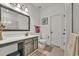 Nicely decorated full bath with large mirror, shower, and neutral color palette at 101 Culpepper Way # 1007, Myrtle Beach, SC 29579