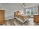 Sunny bedroom featuring vinyl flooring, neutral walls, and two large dressers at 101 Culpepper Way # 1007, Myrtle Beach, SC 29579