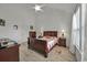 Charming bedroom featuring wood flooring, neutral walls, ceiling fan, and dark wood bedroom set at 101 Culpepper Way # 1007, Myrtle Beach, SC 29579