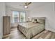Bedroom with luxury vinyl flooring, large window and neutral colored walls at 101 Culpepper Way # 1007, Myrtle Beach, SC 29579