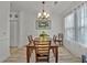 Dining area featuring wood flooring and a modern chandelier with natural light at 101 Culpepper Way # 1007, Myrtle Beach, SC 29579