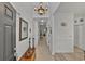 Long hallway with neutral walls and flooring, leading to various rooms in the home at 101 Culpepper Way # 1007, Myrtle Beach, SC 29579