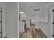 Hallway featuring luxury vinyl flooring and neutral paint at 101 Culpepper Way # 1007, Myrtle Beach, SC 29579