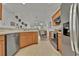 Spacious kitchen showcasing tile flooring, wood cabinetry, and stainless steel appliances at 101 Culpepper Way # 1007, Myrtle Beach, SC 29579