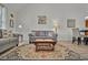 Open living room with wood floors showcases the neutral decor and seamless flow to the dining area and kitchen at 101 Culpepper Way # 1007, Myrtle Beach, SC 29579