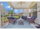 Screened porch offers comfortable seating with an outdoor view and ceiling fan at 101 Culpepper Way # 1007, Myrtle Beach, SC 29579