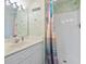 Bathroom featuring a vanity with chrome hardware and a shower/tub combo with curtain at 10106 Duval Dr., Murrells Inlet, SC 29576