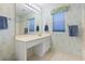 Bathroom featuring a wide mirror over vanity and a window that provides natural light at 10106 Duval Dr., Murrells Inlet, SC 29576