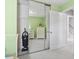 Bedroom featuring mirrored closet doors, light green walls, and white dresser at 10106 Duval Dr., Murrells Inlet, SC 29576
