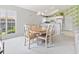 Open concept dining area, connected to the kitchen, with a dining table for six and lots of light at 10106 Duval Dr., Murrells Inlet, SC 29576
