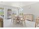 Bright dining room with a round table, seating for six, and views of the landscaped yard at 10106 Duval Dr., Murrells Inlet, SC 29576