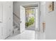 Bright foyer with tiled flooring, open doorway, staircase, and natural light at 10106 Duval Dr., Murrells Inlet, SC 29576