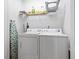 Laundry room with a full size washer and dryer and plenty of storage for detergents at 10106 Duval Dr., Murrells Inlet, SC 29576