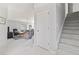 Open-concept living space with view of the staircase and a seating area with plush couches at 10106 Duval Dr., Murrells Inlet, SC 29576
