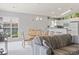 Open-concept living and dining area, featuring a comfortable couch and bright natural light at 10106 Duval Dr., Murrells Inlet, SC 29576